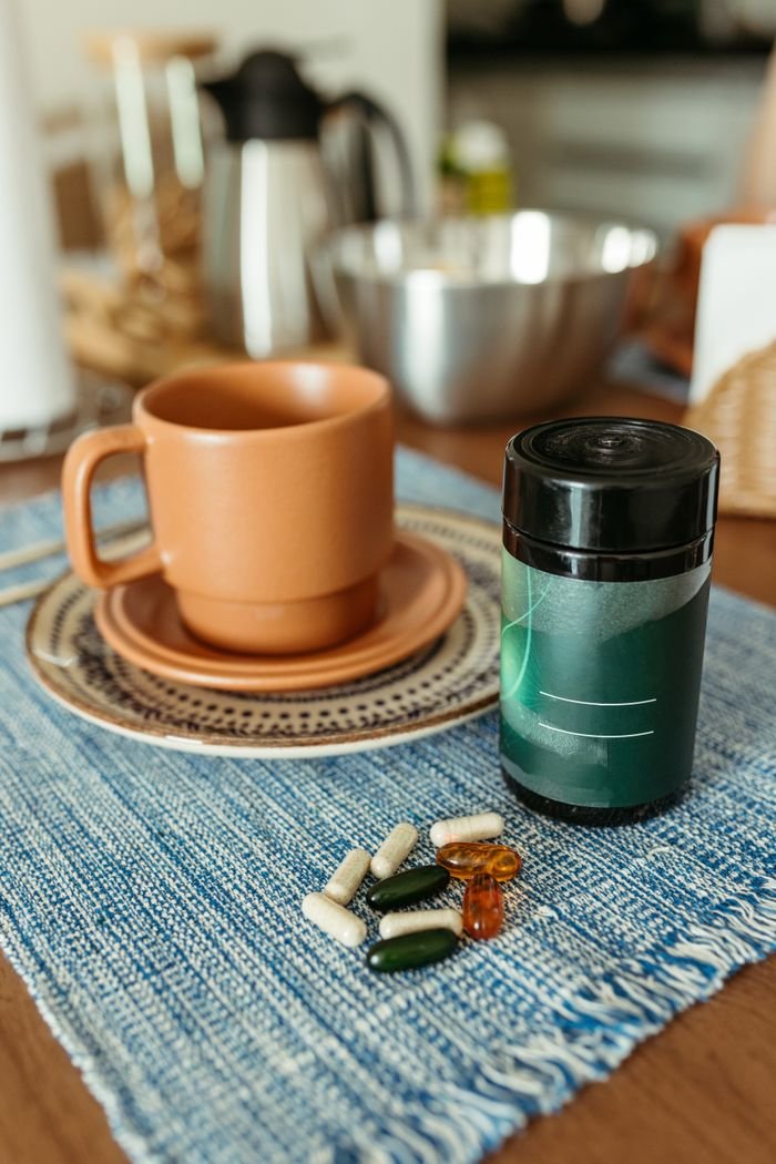 Crafting Captivating Headlines: Your awesome post title goes here Cozy kitchen scene featuring vitamins and a cup on a wooden table, promoting health and wellness.